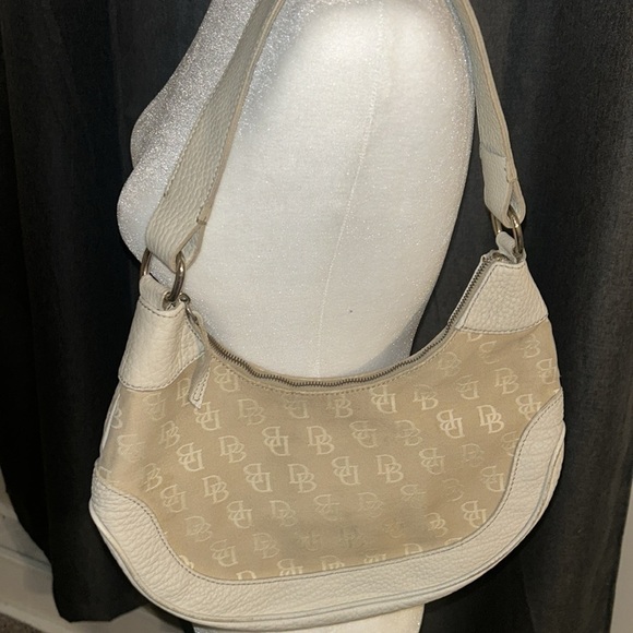 Dooney & Bourke Handbags - Dooney and Bourke vintage hobo purse in the color cream.